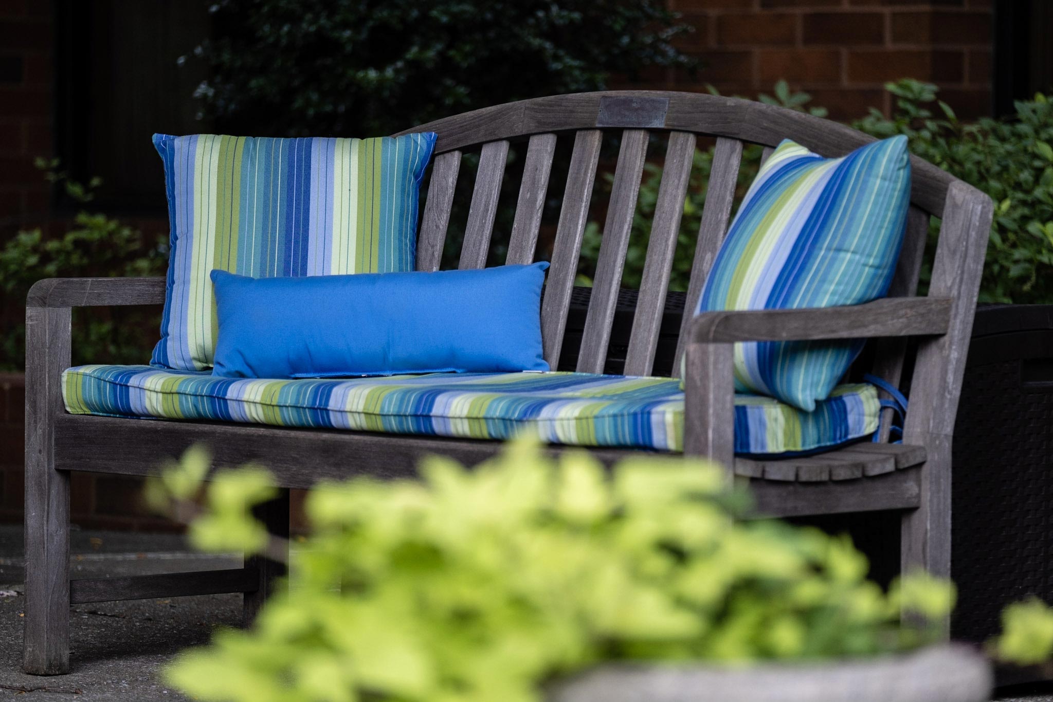 A comfy outdoor patio bench